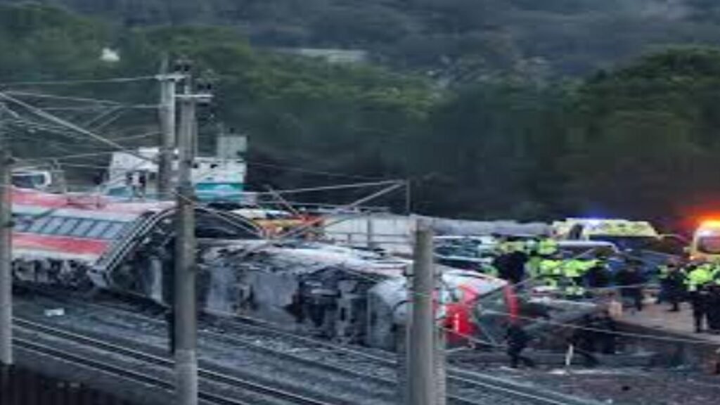 Police and rescue teams at a train crash site in Spain